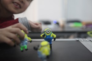 child plays with her works